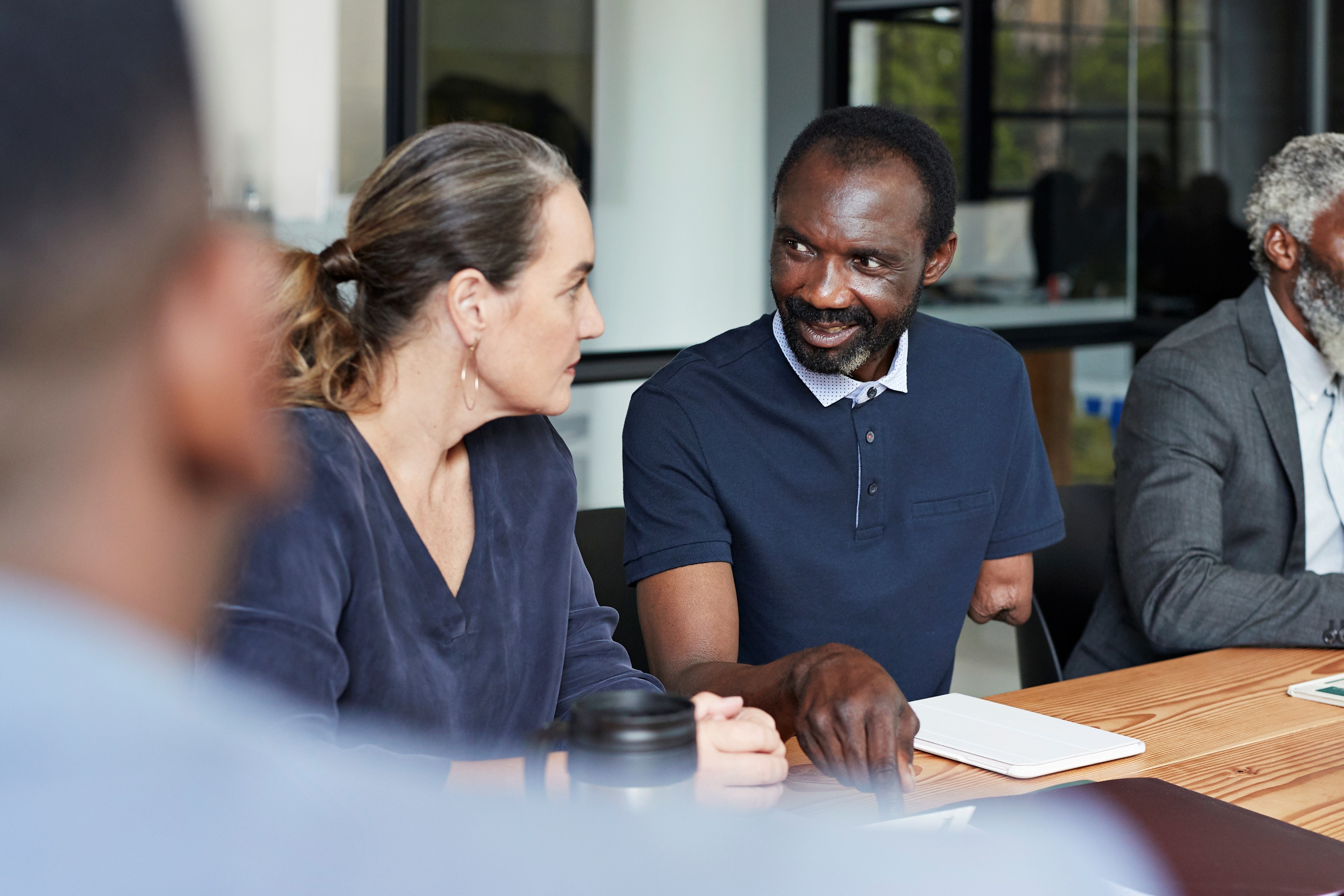 Stakeholder negotiation meeting focused on scope, cost, and delivery tradeoffs